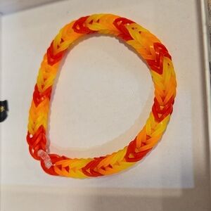 Handmade rubber band type bracelet. Very pretty colors.